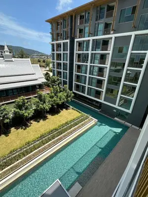 an aerial view of a building with a swimming pool at The Ozone Condominium 514 one bedroom in Laguna Phuket