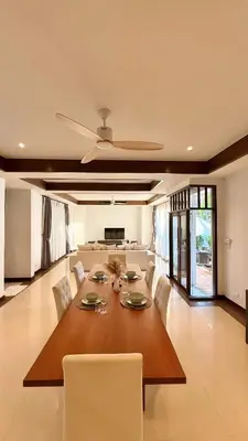 a large living room with a table and chairs at Phuket Cozy Villa Pasak4 Green Garden BangTao in Laguna Phuket