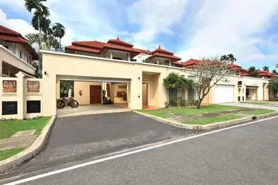 a large white house with a driveway at Laguna Golf View Pool Villa in Ban Thalat Choeng Thale