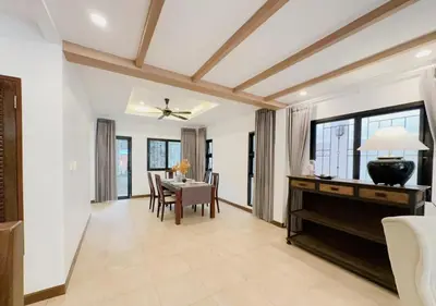 a dining room with a table and a ceiling at 3 Bedroom Renovated Villa 3 minutes to the beach in Karon Beach