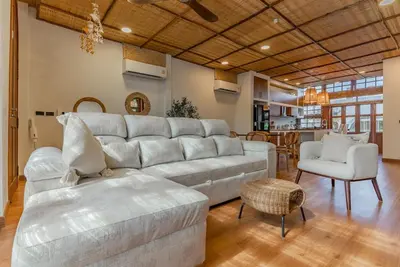 a living room with a large couch and a chair at Private Designer Villa with Pool Prime Rawai 3 beds in Ban Saiyuan (1)