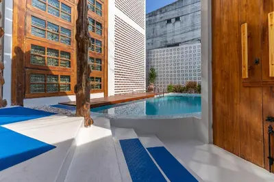 a swimming pool with a view of a building at Private Designer Villa with Pool Prime Rawai 3 beds in Ban Saiyuan (1)