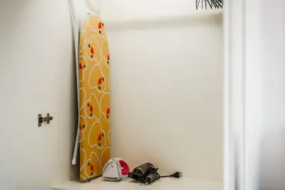 a shelf with a snowboard in a room at A Stylish Condo in Local Area Kathu, Phuket in Kathu