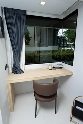 a room with a window with a desk and a chair at апартаменты с двумя спальнями in Karon Beach