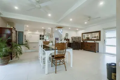 a living room with a white table and chairs at Koson Elegant 3 Bedroom Villa in Rawai Beach