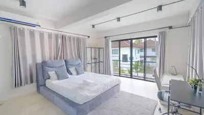 a bedroom with a bed and a large window at 5BR Lucky Pool Villa Kathu Golf - 12 guest in Kathu