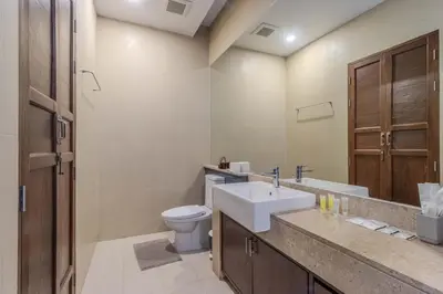 a bathroom with a sink and a toilet at V241 3BR Peaceful Pool Villa, Garden & Jacuzzi in Koh Lone