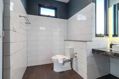 a white bathroom with a toilet and a sink at V243 Quite 3BR Pool Villa Bathtub Near Beach in Bang Tao Beach