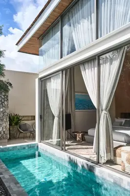 a villa with a swimming pool and a bedroom at Trinity 4 BDR POOL Villa in Ban Pak Lak