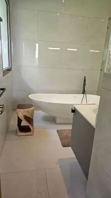 a bathroom with a tub and a sink and a bath tub at Beautiful Andamaya sea view in Ban Thalat Choeng Thale