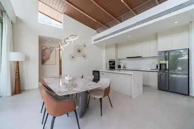 a kitchen with a dining room table and chairs at 3bdr New Luxury Villa Bang Tao by CapitalPro ASH-06 in Ban Phru Champa