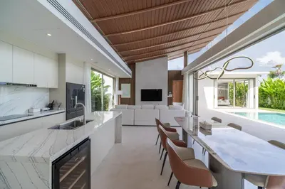an open kitchen and dining room with a table and chairs at 3bdr New Luxury Villa Bang Tao by CapitalPro ASH-06 in Ban Phru Champa