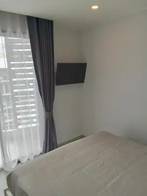 a bedroom with a bed and a window at Stylish Urban Escape 1Bed Apt T2-822 in Chalong