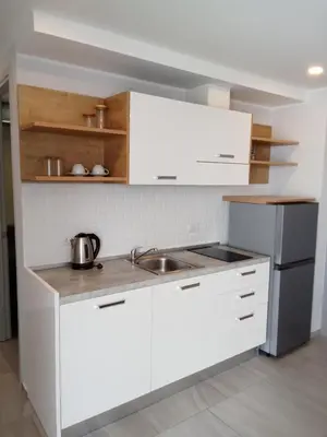a kitchen with white cabinets and a sink at Stylish Urban Escape 1Bed Apt T2-822 in Chalong