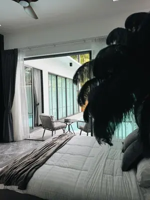 a bedroom with a large bed and a large window at Exclusive 2BR Pool Villa in Ban Saiyuan (1)