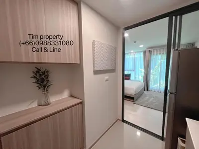 a room with a door leading to a bedroom at The Base Rise Central Phuket in Ban Rangeng