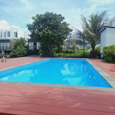 a large blue swimming pool in a yard at The wide view resort and restaurant Phuket in Thalang