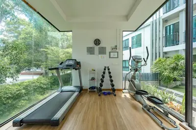 a gym with two treadmills and a treadmill at C237 Brand New 1BR Condo Pool Gym Near Beach in Bang Tao Beach