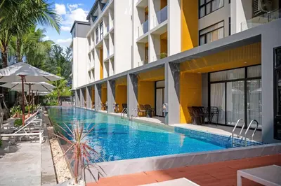 a swimming pool in front of a building at Wyndham Gardens Elegant Studio Forrest View 2228 in Phuket Town