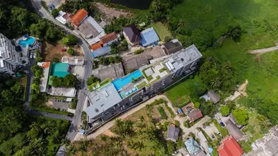 an overhead view of a house with a train at Apartment Seaview Rooftop Pool Surin beach 650m in Surin Beach