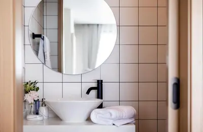 a bathroom with a sink and a mirror at FantaSea condo Kamala 205 in Kamala Beach