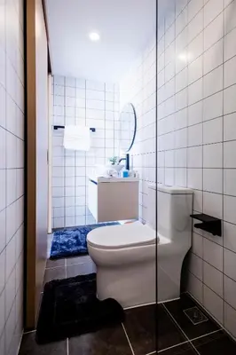 a bathroom with a toilet and a sink at FantaSea condo Kamala 205 in Kamala Beach