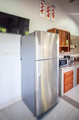 a stainless steel refrigerator in a kitchen at House 4 people sea view 100 m from the beach in Klong Muang Beach