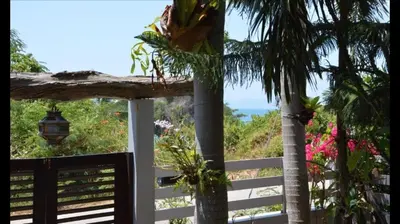 a view of the ocean from the porch of a house at House 4 people sea view 100 m from the beach in Klong Muang Beach