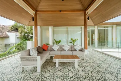 a living room with a couch and a table at Akal pool villa 3BR near Laguna, Bangtao & Beach in Bang Tao Beach