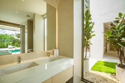 a bathroom with two sinks and a mirror at Akal pool villa 3BR near Laguna, Bangtao & Beach in Bang Tao Beach