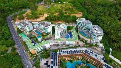 an aerial view of a resort with a pool at Spectacular two bed penthouse amazing sea views in Patong Beach