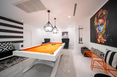 a room with a ping pong table in it at Seascape 6BR Prestige Villa Skyline Pool in Kamala Beach