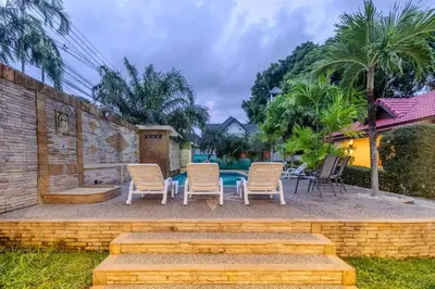 a group of chairs sitting on a patio at V247 Poolside 1BR Near Naiharn Beach & Gym in Rawai Beach