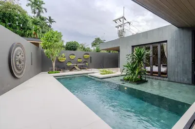 a swimming pool in the backyard of a house at V253 Brand New 2BR with Pool and Full Kitchen in Thalang