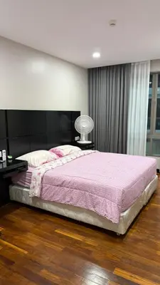 a bedroom with a large bed with a pink blanket at Квартира в центре Бангтао в комплексе The Regent Bangtao in Bang Tao Beach