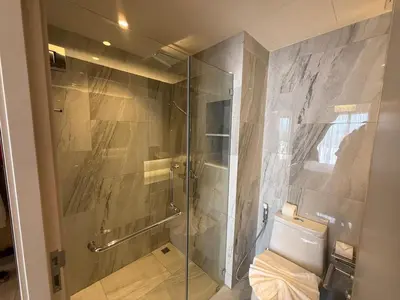 a bathroom with a glass shower with a toilet at New studio of Bangtao Bellevue Lagoon 213 in Laguna Phuket