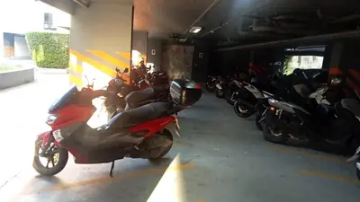 a group of motorcycles parked in a garage at palmyrah apartment 300 meters from surin beach in Ban Nong Chaeng