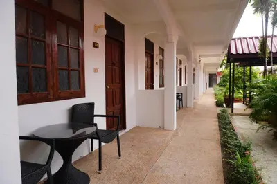a table and chairs next to a building at Residy Downtown Hotel in Patong Beach