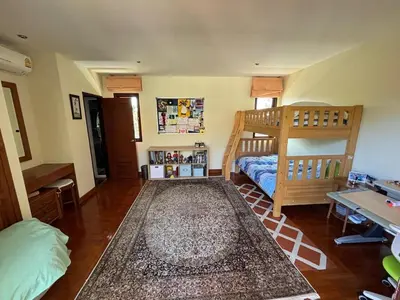 a bedroom with a bunk bed and a desk at 5BR Luxury Villa Bangtao With Staff Phuket in Laguna Phuket