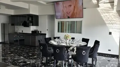 a dining room with a table and chairs at PATONG TOWER Luxury Large Apartments in Patong Beach