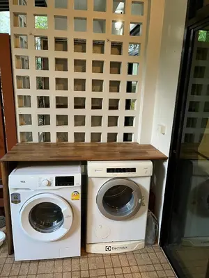 a washer and dryer sitting next to each other at Rawai Beach Villa in Nai Harn Beach