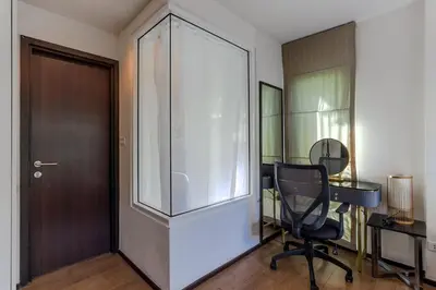 an office with a glass door and a desk and a chair at C239 Best Spot Beachfront 1BR Near Top Beaches in Rawai Beach