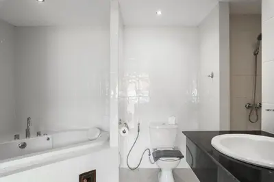 a bathroom with a sink and a toilet and a bath tub at Condominium Rawai D1 - near convenience beach, market, gym in Rawai Beach