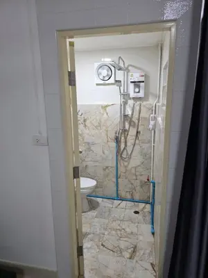 a bathroom with a shower and a toilet at Monkey Apartment 38 in Patong Beach