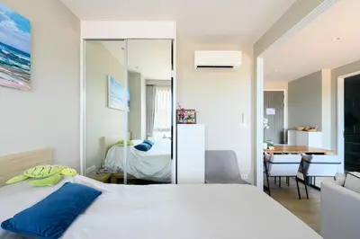 a bedroom with a bed and a dining room at Diamond Condominium Phuket 2BR 5 min to Bangtao beach in Bang Tao Beach
