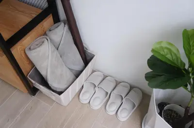 a pair of white shoes sitting next to a plant at A&J Holiday Villa in Ban Na Bon