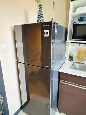 a refrigerator in a kitchen with a christmas tree on top at MBC Condotel Maikhao beach in Mai Khao Beach