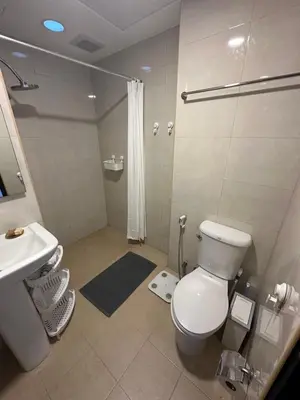 a bathroom with a toilet and a sink and a shower at Комфортные апартаменты Пхукет NBC in Rawai Beach