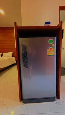 a machine with a remote control in a room at Baan Phu Chalong Place in Ban Suan