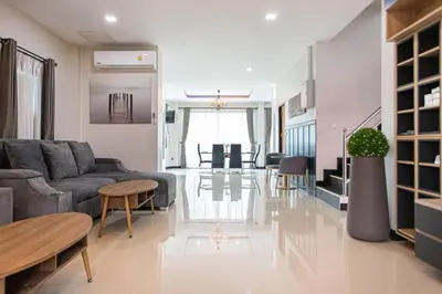 a living room with a couch and a table at Kathu V pool villa 170 in Kathu
